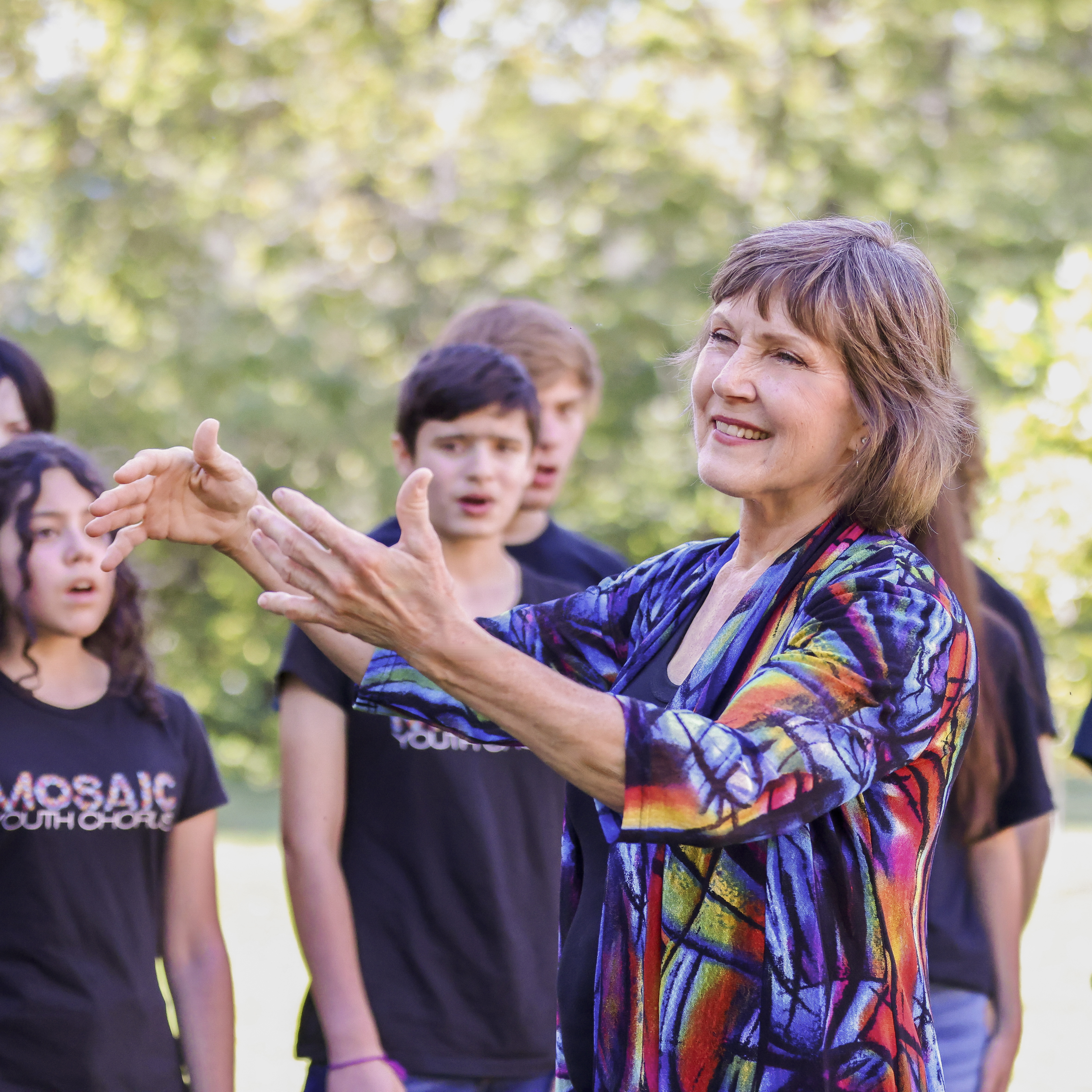 Dr. Joy Hirokawa conducts Mosaic Youth Chorus in song