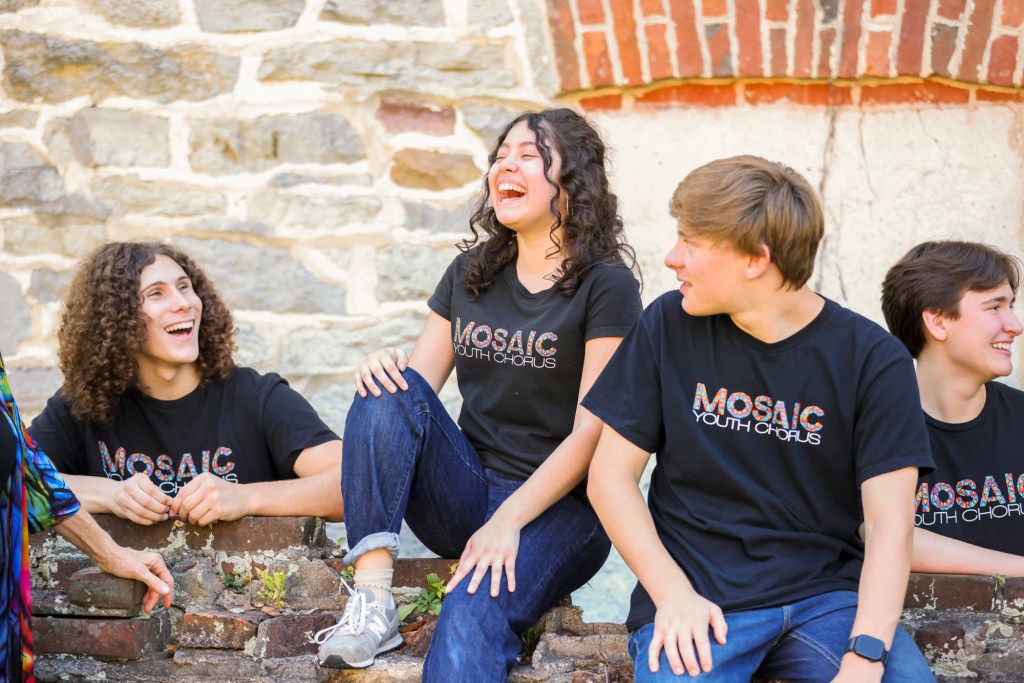 Close-up of a few members of MYC laughing together in downtown Bethlehem, PA